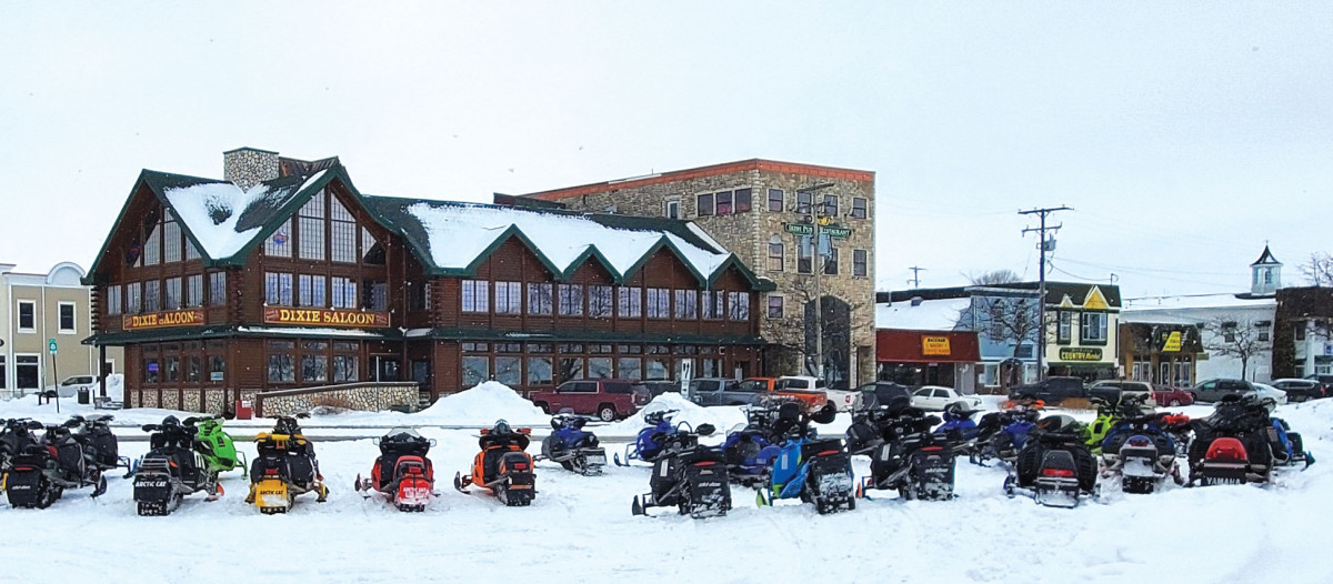 Snowmobiles parked outside the World Famous Dixie Saloon